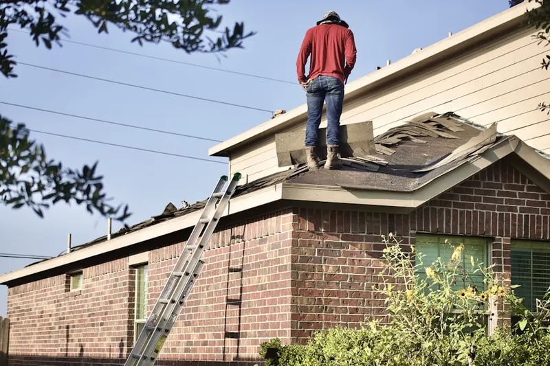 Professional roofer working on a residential roof in San Gabriel